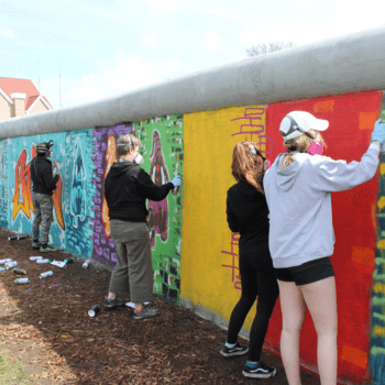 Students painting on the wall